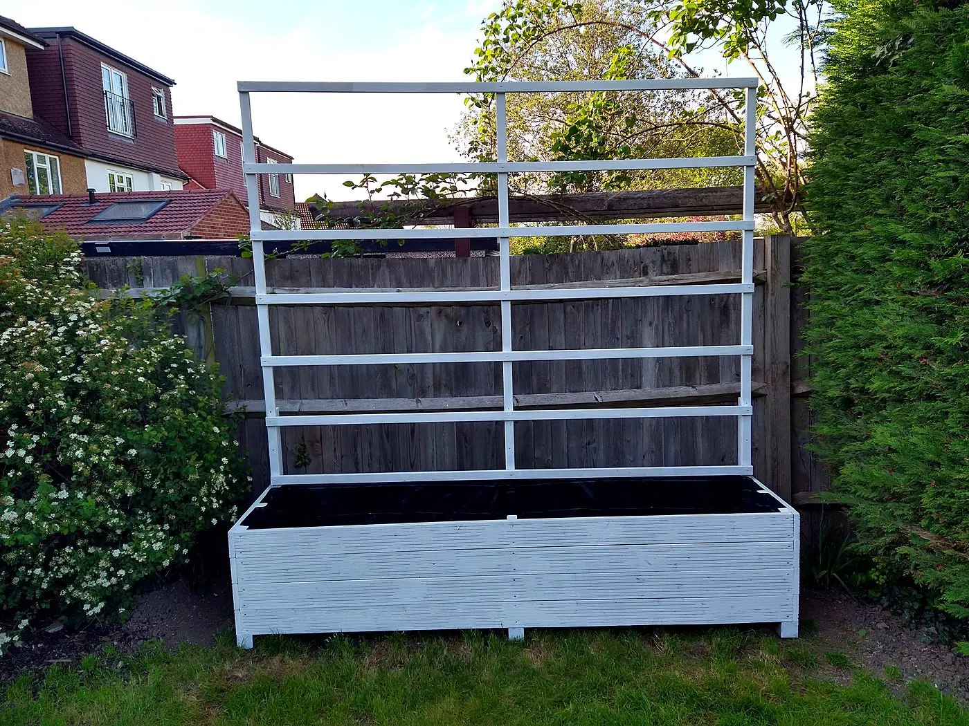 Custom painted planter with integrated trellis