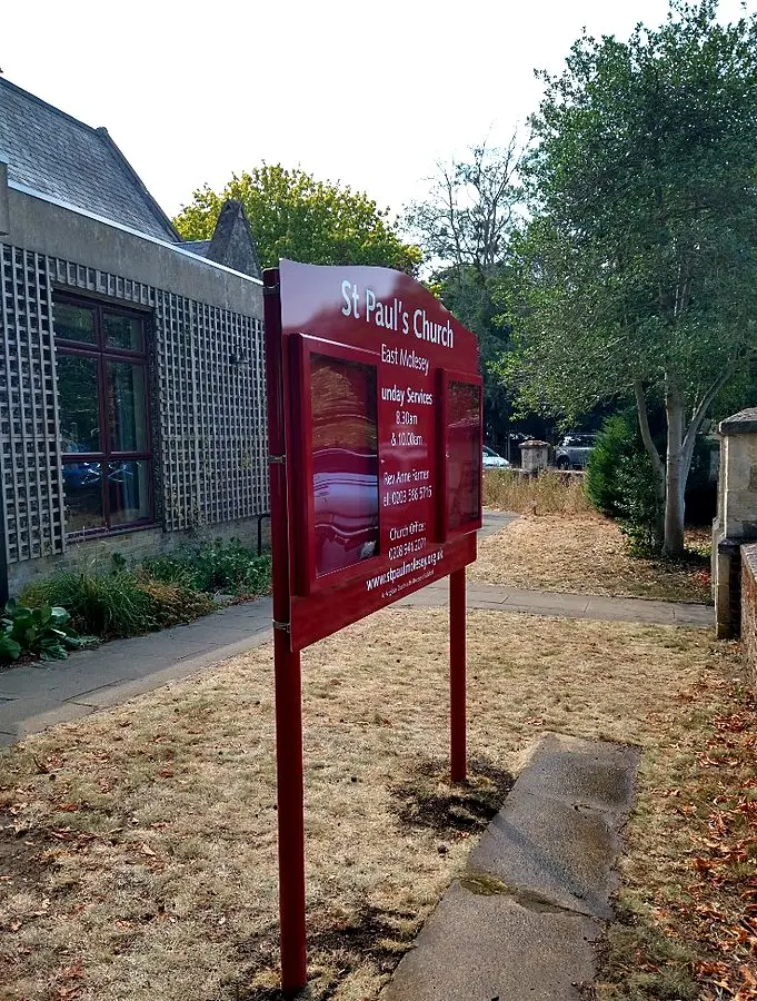Three-quarter view of installed church noticeboard on posts